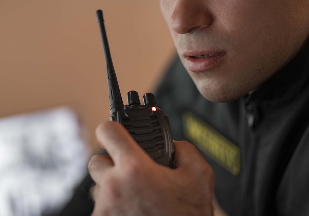 portrait-male-security-guard-with-radio-station-camera-screens (1) portrait-male-security-guard-with-radio-station-camera-screens (1)