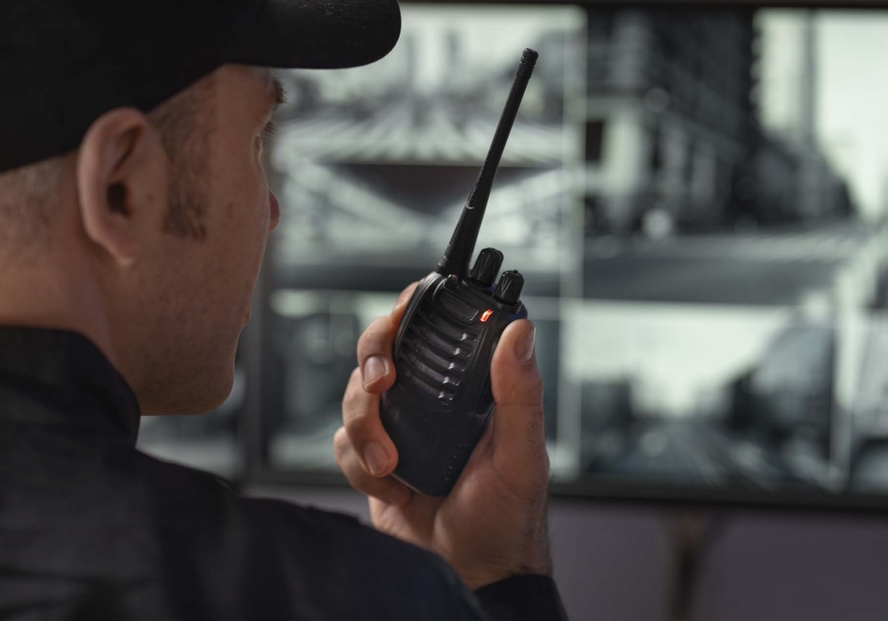 portrait-male-security-guard-with-radio-station-camera-screens (2) portrait-male-security-guard-with-radio-station-camera-screens (2)