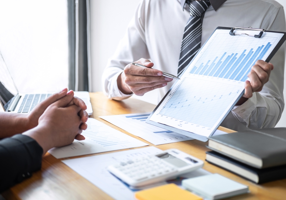 Professional Executive business team brainstorming on meeting to Professional Executive business team brainstorming on meeting to planning investment project working and strategy of business making conversation with partner and consultation of collaboration.